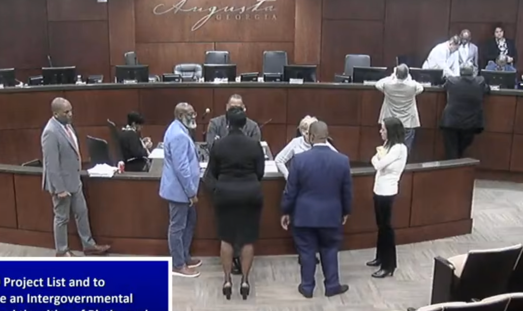Augusta officials discuss the SPLOST 9 package during a meeting recess Tuesday.